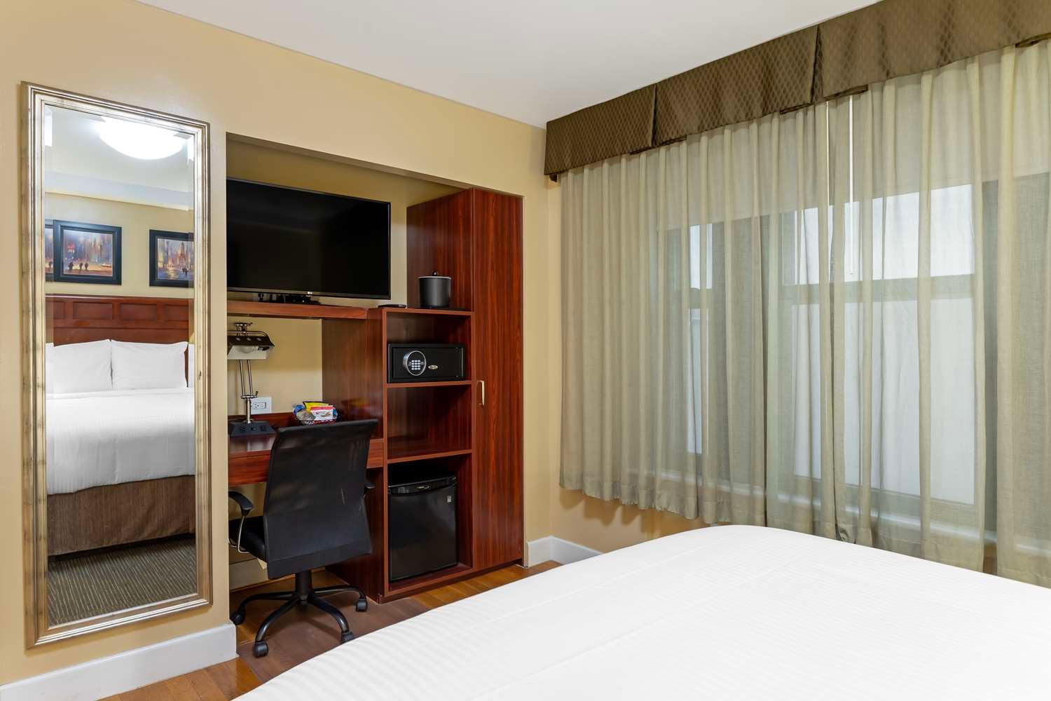 Set of hotel amenities (such as towels, shampoo, soap etc) on the bed. Hotel  amenities is something of a premium nature provided in addition to the room  when renting a room. Stock